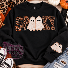 Load image into Gallery viewer, Black Spooky Halloween sweatshirt featuring leopard-print lettering and cream lace-style ghost graphics.