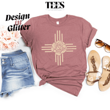 Load image into Gallery viewer, New Mexico Zia glitter t-shirt in dusty rose with rose design paired with denim shorts and sandals