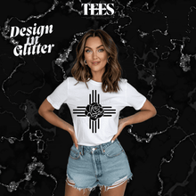 Load image into Gallery viewer, New Mexico Zia glitter t-shirt in white with black Zia symbol and rose design, worn with denim shorts