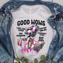 Load image into Gallery viewer, White t-shirt with skeleton design and text on a denim jacket background
