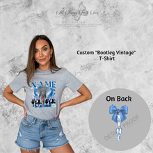 Load image into Gallery viewer, Woman wearing custom bootleg vintage t-shirt in gray with blue design and personalized name print
